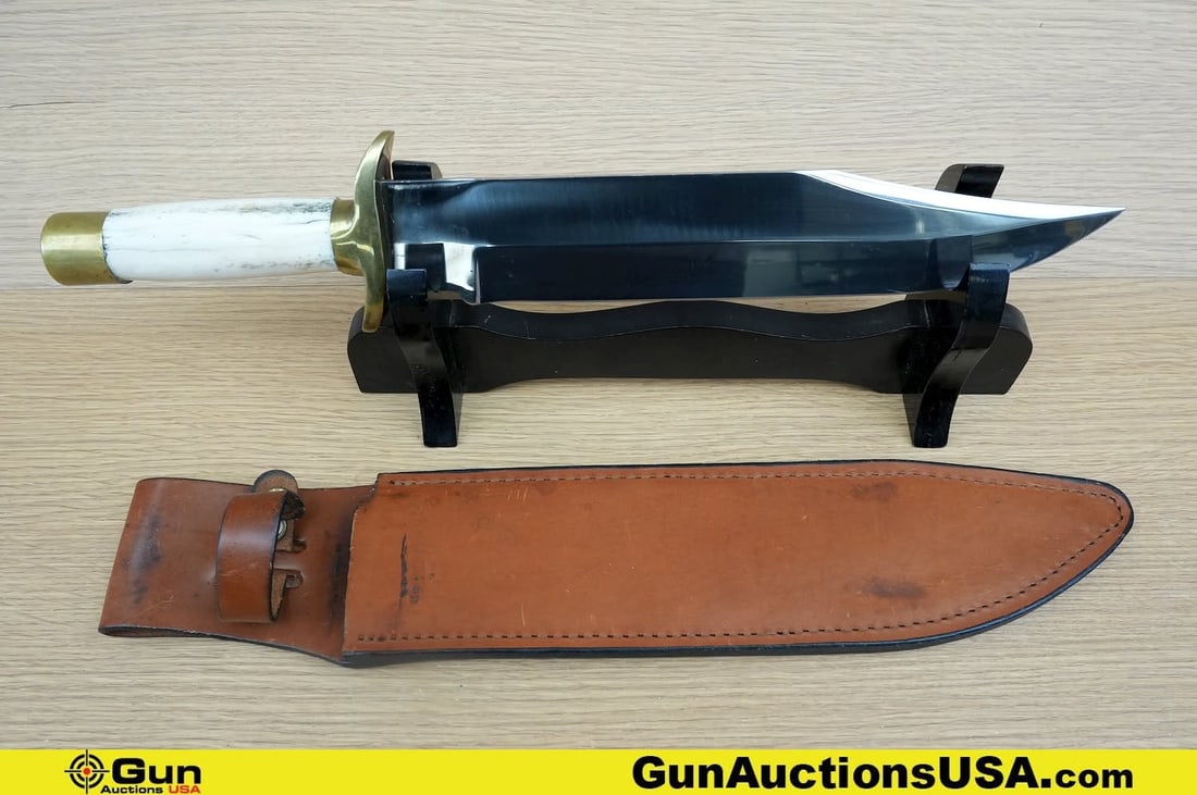 Will Star Knife. Excellent. . 11.25" Blade, 16.5" Overall Will Star Bowie Knife, with Bone Handle: Will Star Knife. Excellent. . 11.25" Blade, 16.5" Overall Will Star Bowie Knife, with Bone Handle and Brass Hilt Along with Leather Scabbard. Includes a Wood Display Stand. . (83540) (GSCO52)