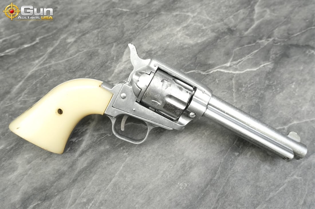 F.I.E. CORP E-15 .22 LR Revolver 4.75" Barrel, sn:E606314 Fair Condition Revolver with a spray: F.I.E. CORP E-15 .22 LR Revolver 4.75" Barrel, sn:E606314 Fair Condition Revolver with a spray painted finish throughout. Fitted with smooth cream-colored synthetic one-piece grips, and Six-shot flute