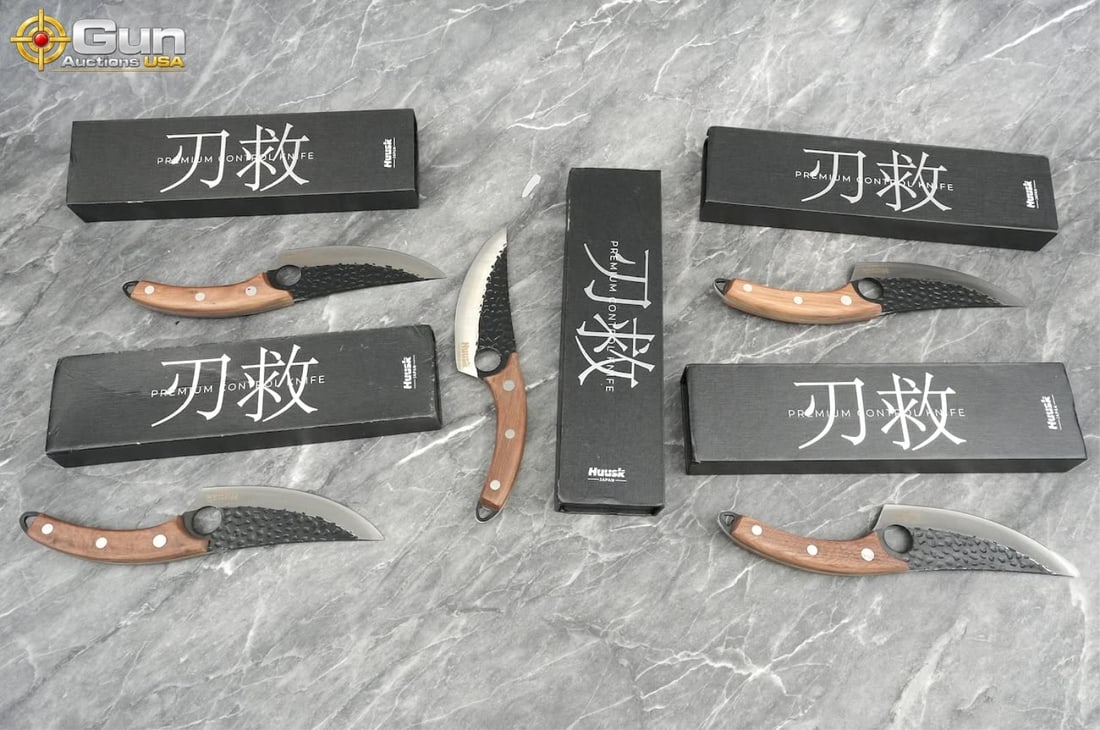 Five Huusk premium control knives with boxes. Like New Condition. This group features five Huusk: Five Huusk premium control knives with boxes. Like New Condition. This group features five Huusk chef knives designed with curved blades and a distinctive finger hole for precision control. Each knife