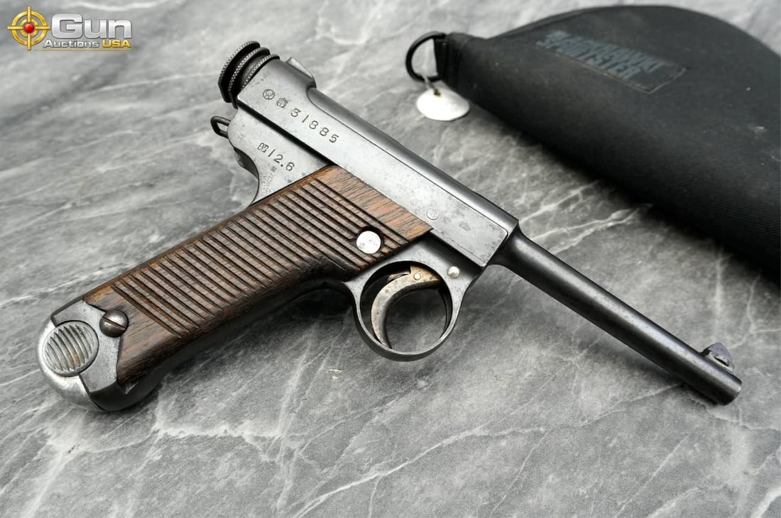 Pre-WWII Japanese Nagoya Arsenal Type 14 Nambu 8mm Pistol ? June 1937. Good Condition Normal: Pre-WWII Japanese Nagoya Arsenal Type 14 Nambu 8mm Pistol ? June 1937. Good Condition Normal Handling Marks. 4.5" Barrel. Shiny Bore, with Shallow Rifling, Tight Action Semi Auto . A highly desirable,