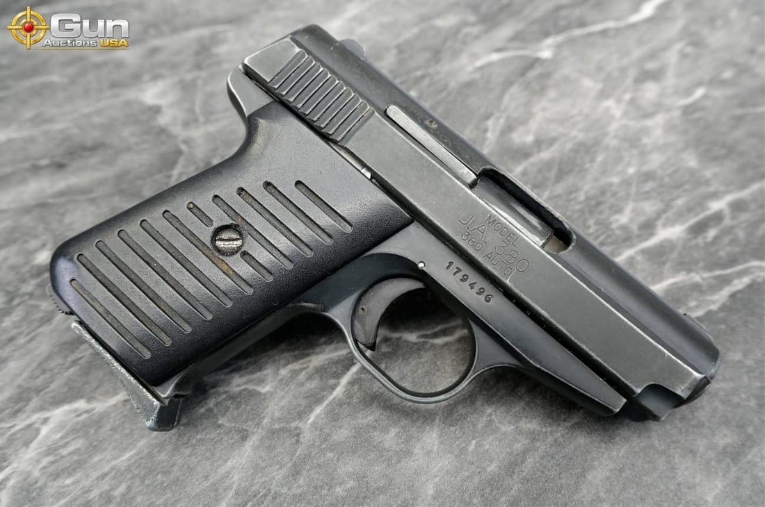 PHOENIX RAVEN .25 AUTO Pistol Barrel, sn:3033384 Needs Repair Compact .380 pistol from Jimenez: PHOENIX RAVEN .25 AUTO Pistol Barrel, sn:3033384 Needs Repair Compact .380 pistol from Jimenez Arms featuring a matte dark finish throughout, textured panels on the frame for a secure hold, and a stra