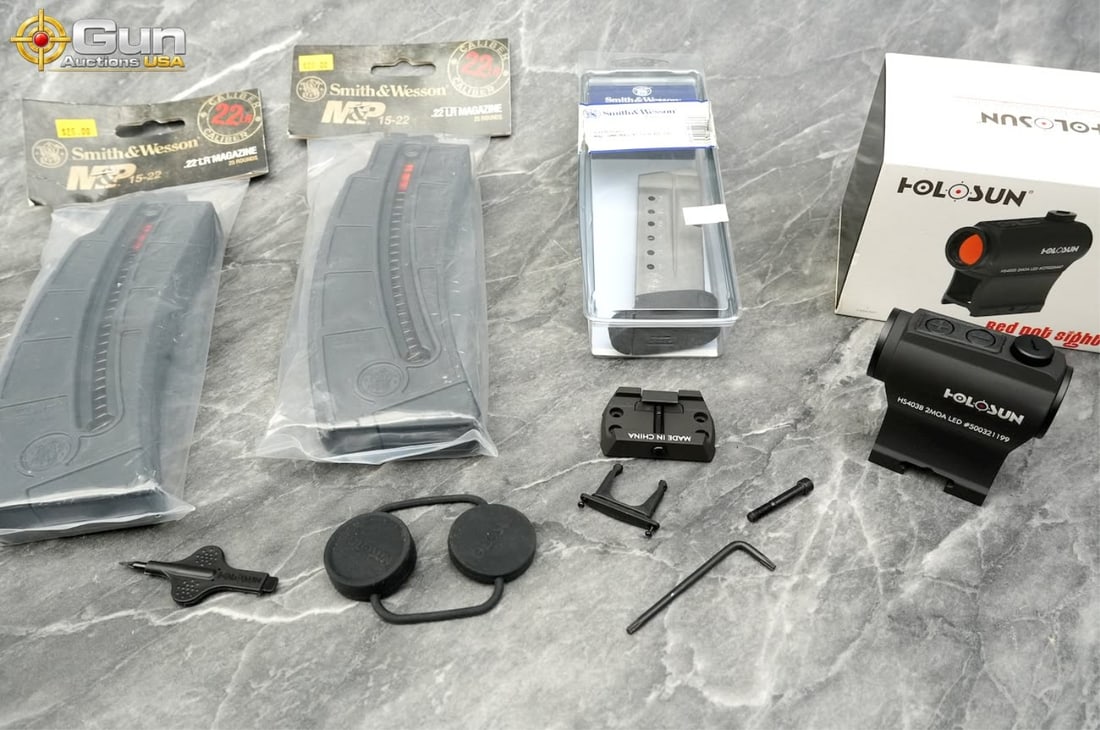 One Holosun optic and three Smith & Wesson mags. Excellent Condition. Variety of firearm accessories (1 of 7)