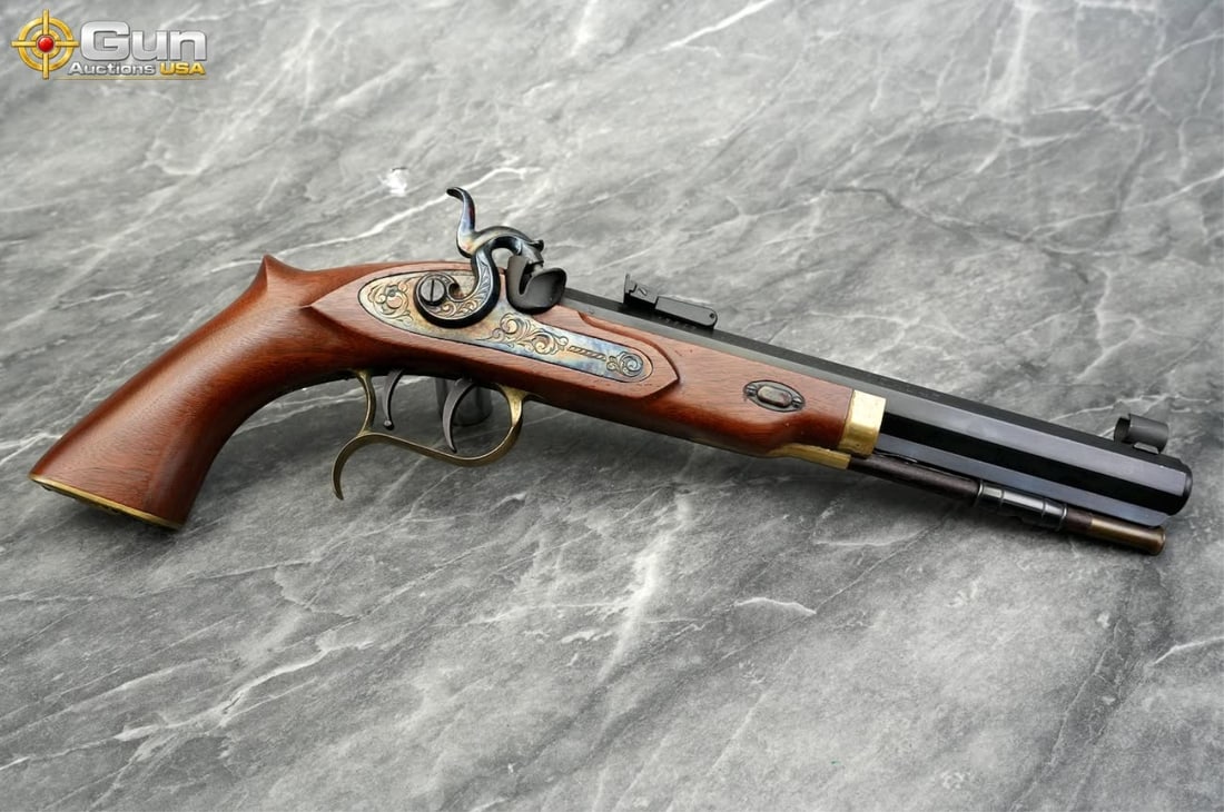 Thompson Center Arms Patriot .45 Caliber Pistol, 9" Barrel, Needs Repair This muzzleloading black: Thompson Center Arms Patriot .45 Caliber Pistol, 9" Barrel, Needs RepairThis muzzleloading black powder pistol features a dual-set trigger, adjustable rear sight, engraved lockplate, and ornate brass 