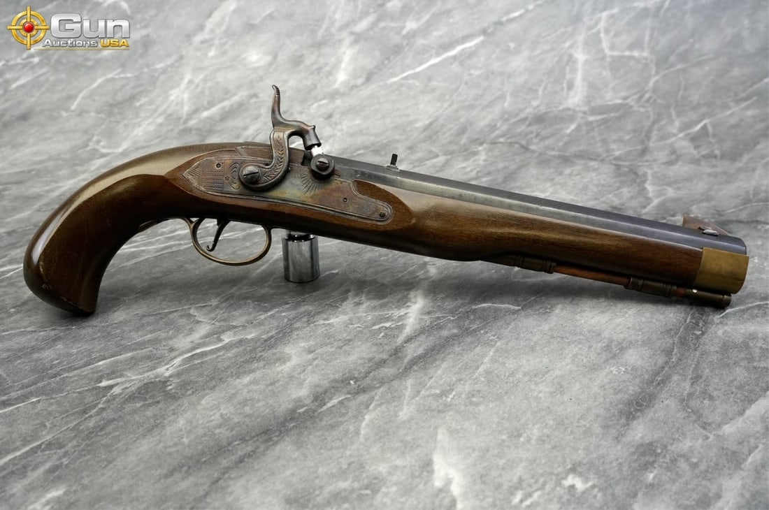 Jukar Spain .45 Caliber Percussion Pistol, 9.75" Barrel, Good Condition, Normal Handling Marks This: Jukar Spain .45 Caliber Percussion Pistol, 9.75" Barrel, Good Condition, Normal Handling MarksThis single-shot black powder pistol features an octagonal blued barrel, fixed front sight, drift adjustab