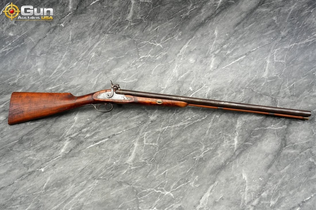 Connecticut Valley Arms, Inc. 12 Ga. Shotgun, 28 5/8" Barrel, Good Condition, Normal Handling Marks: Connecticut Valley Arms, Inc. 12 Ga. Shotgun, 28 5/8" Barrel, Good Condition, Normal Handling MarksThis black powder double barrel percussion shotgun features side-by-side barrels, dual hammers and tr