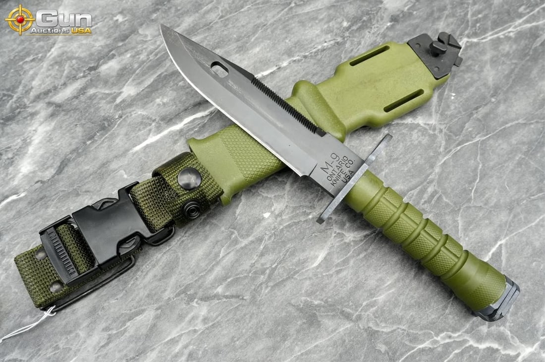 Ontario Knife Co. M-9 Bayonet with Scabbard, Excellent Condition This military tactical knife: Ontario Knife Co. M-9 Bayonet with Scabbard, Excellent ConditionThis military tactical knife features olive drab green ribbed polymer handle, crossguard with muzzle ring, and serrated spine. The match