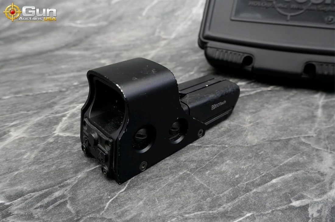 EOTech holographic weapon optic, Good Condition This matte black EOTech optic features an integrated: EOTech holographic weapon optic, Good ConditionThis matte black EOTech optic features an integrated protective hood along with windage and elevation adjustment dials. Includes original box and