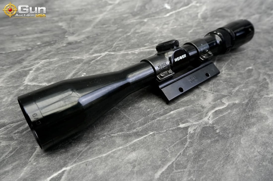 Weaver 3-9x38 rifle scope, Good Condition This gloss black rifle scope features 3-9x variable: Weaver 3-9x38 rifle scope, Good ConditionThis gloss black rifle scope features 3-9x variable magnification, 38mm objective lens, capped adjustment turrets, and installed mounting rings attached to a r