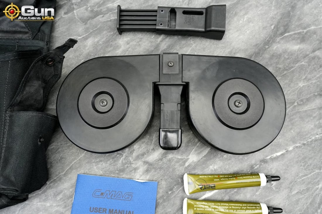 Beta Company 100-round C-Mag drum magazine, Very Good Condition This 9mm dual drum magazine includes: Beta Company 100-round C-Mag drum magazine, Very Good ConditionThis 9mm dual drum magazine includes a black nylon storage pouch labeled part number PHM906 from The Beta Company. (500494) (GSCM61)