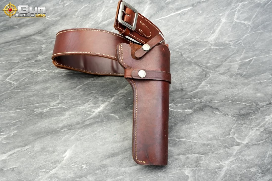 Smith & Wesson Model 21 26/ George Lawrence Co Leather Western Gun Belt, Large and Holster Rig,: Smith & Wesson Model 21 26/ George Lawrence Co Leather Western Gun Belt, Large and Holster Rig, Very Good ConditionThis rich brown leather Western-style gun belt and holster features a left-handed dro