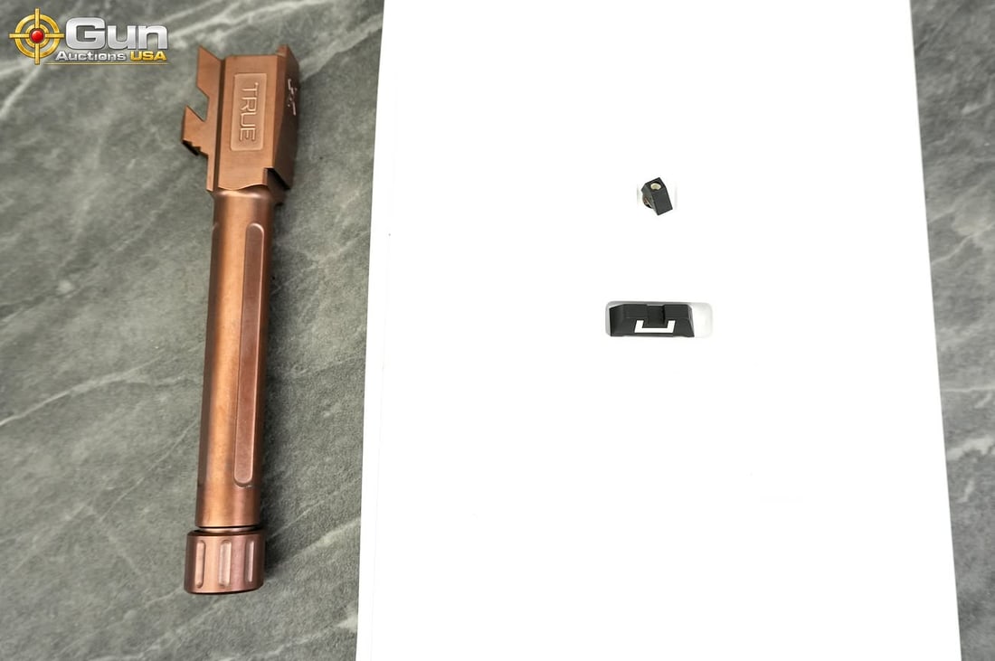 Glock OEM sights and True Precision Glock 48 barrel, Excellent Condition This group consists of a: Glock OEM sights and True Precision Glock 48 barrel, Excellent ConditionThis group consists of a set of Glock OEM sights in a Trijicon box and a copper-finished True Precision Glock 48 threaded barrel