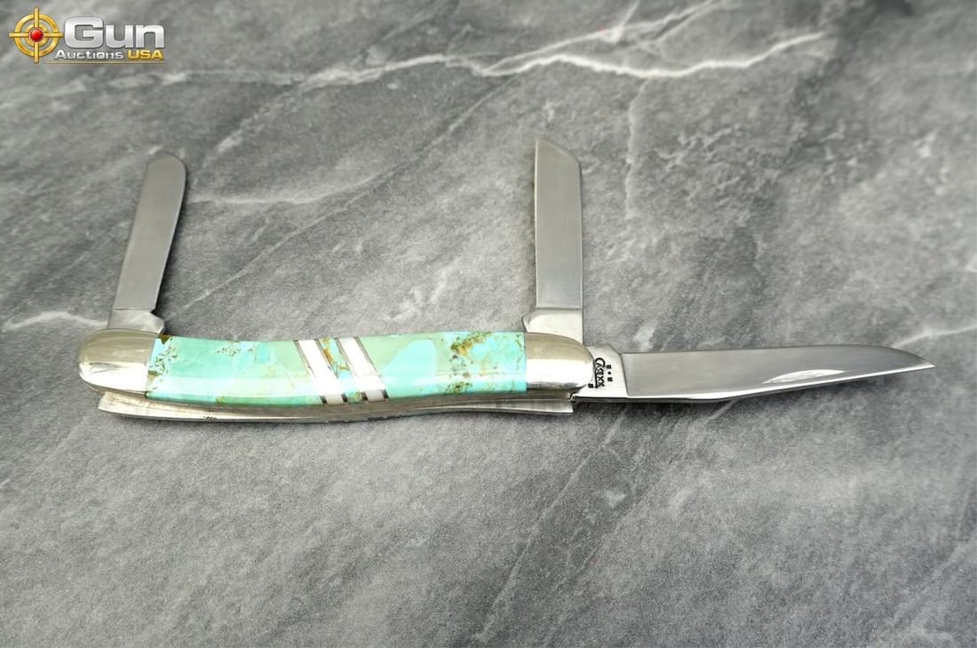 One Case XX EX318 SS folding pocket knife, Very Good Condition This single pocket knife features: One Case XX EX318 SS folding pocket knife, Very Good ConditionThis single pocket knife features distinctive turquoise-colored handle scales inlaid with diagonal silver-tone accent stripes. The multi-b