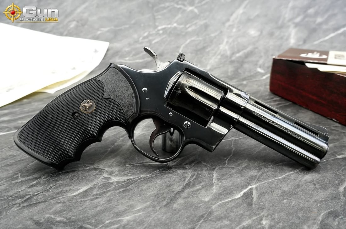 COLT PYTHON .357 MAG 4" REVOLVER: COLT PYTHON .357 MAGNUM SNAKE GUN Revolver, 4" Barrel, Excellent Condition, Shiny Bore, Tight Action, sn:86455EThis iconic Colt Python wears a deep, polished royal-blue finish across its