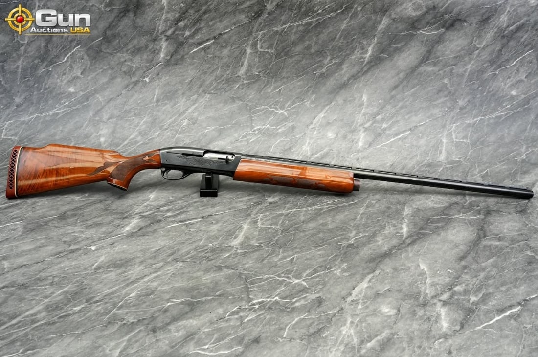 REMINGTON 1100 12GA SEMI SHOTGUN: REMINGTON 1100 12 GA. Semi Auto Shotgun, 30" Barrel, Very Good Condition, Shiny Bore, Tight Action, sn:L702243VThis 12-gauge features an extra-fancy walnut stock with a Monte Carlo cheekpiece and a ni