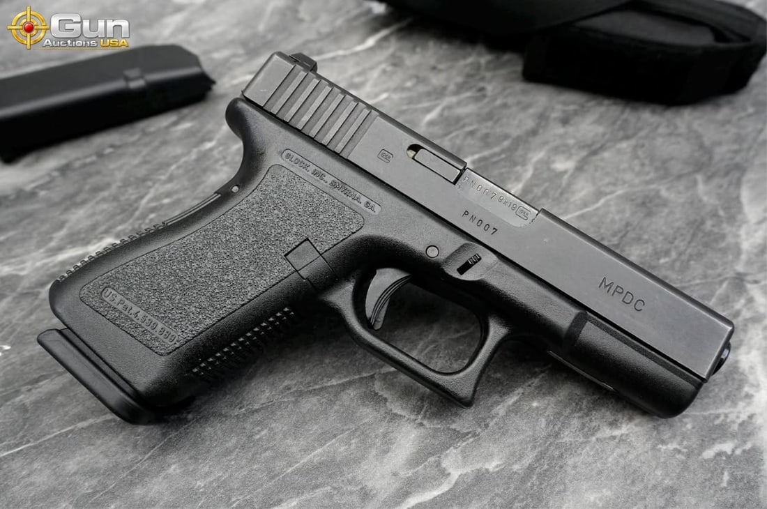 GLOCK 19 9MM PISTOL, Famed '007' sequence SN: Glock 19 9X19 Pistol, 4" Barrel, Excellent Condition, 007 serial # and MPDC stamp. sn:9N007 This Austrian-made Gen 2 pistol wears a matte black finish throughout. Carrying the iconic '007' contract
