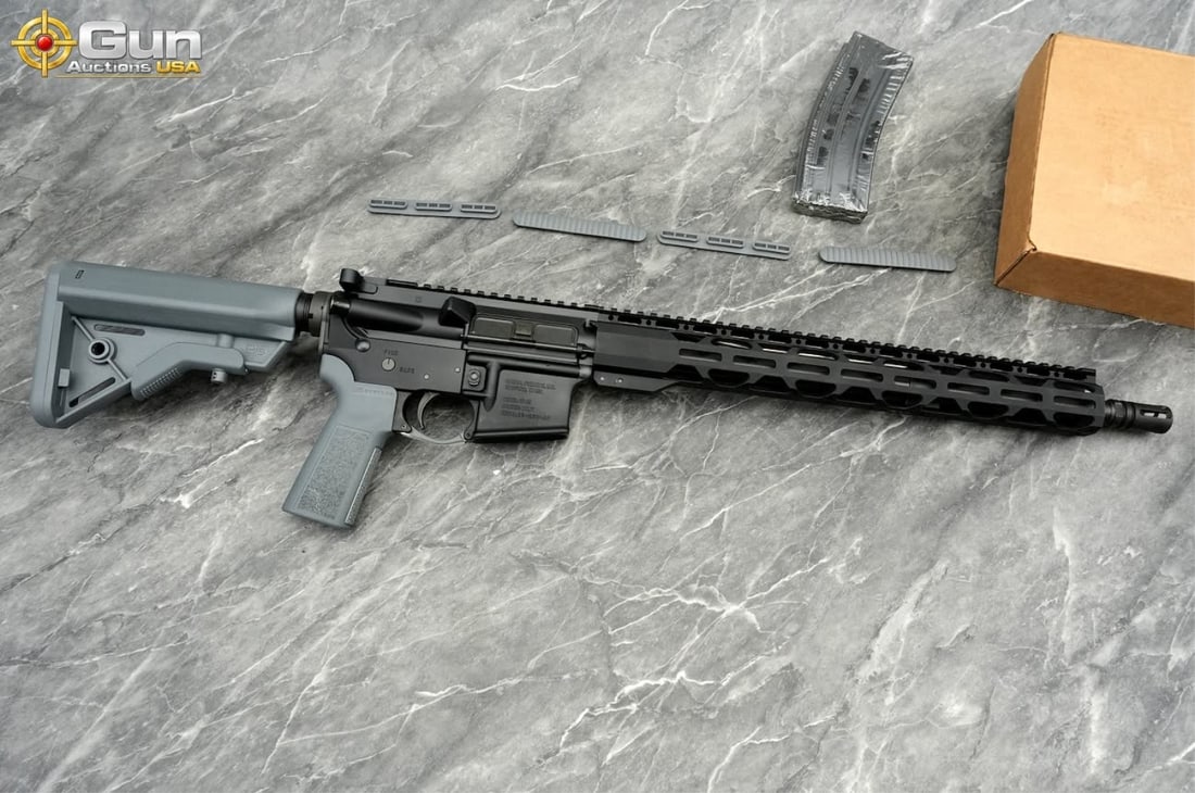 RADICAL RF-15 5.56 SEMI AUTO RIFLE: RADICAL FIREARMS RF-15 5.56 NATO THREADED BARREL Semi Auto Rifle, 16" Barrel, Like NEW, sn:23-050469This AR-15-pattern rifle balances a matte black upper and lower receiver against a gray B5 Systems c
