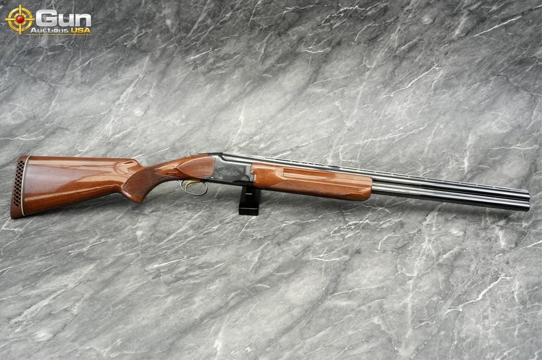 BROWNING CITORI 12GA O/U SHOTGUN: Browning CITORI 12 ga. Over-Under Shotgun, 26" Barrel, Very Good Condition, Shiny Bores, Tight Action, sn:14191RP153This over-under in 12 gauge features a blued receiver tastefully engraved with scrol
