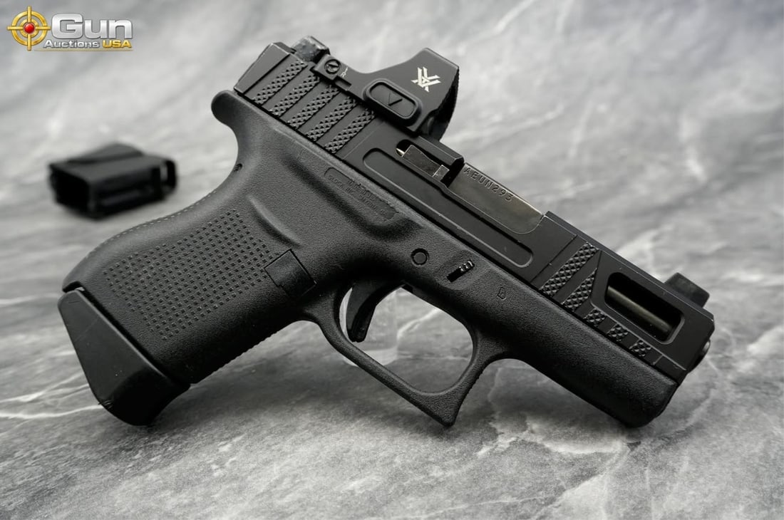 GLOCK 43 9MM SEMI AUTO PISTOL: GLOCK 43 9X19 Semi Auto Pistol, 3.5" Barrel, Excellent Condition, Shiny Bore, Tight Action, sn:AEUN293This subcompact 9mm pistol is fitted with an aftermarket Sabre slide featuring aggressive