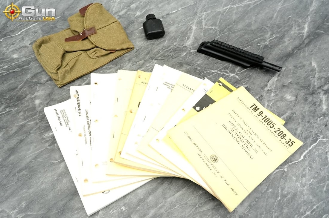 U.S. Military Manuals and firearm parts/accessorie: U.S. military manuals and firearm parts/accessories. Good Condition.This lot brings together eleven U.S. military technical manuals (including TM 9-1005 series titles), a canvas AK-pattern magazine po