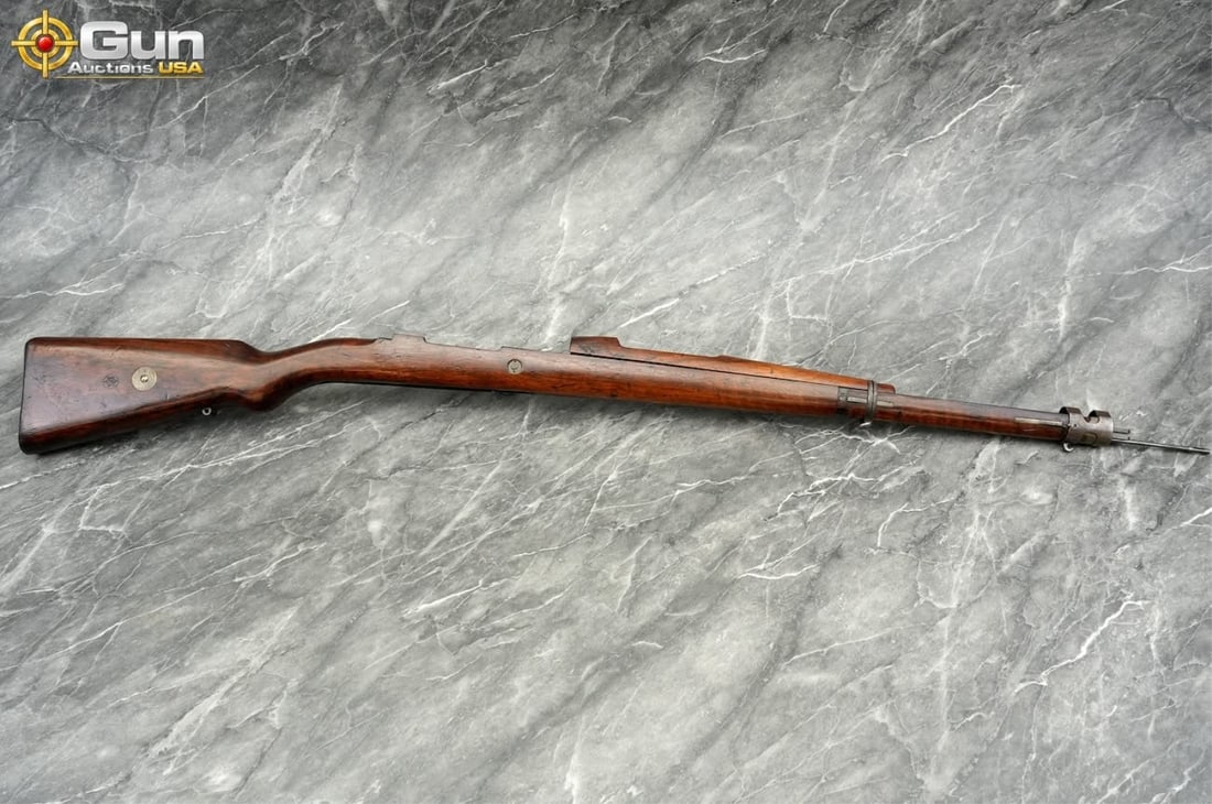 Spanish M1943 rifle wooden stock. Very Good Condit: Spanish M1943 rifle wooden stock. Very Good Condition for its age.This authentic Spanish M1943 (Mauser) wooden rifle stock retains its original metal hardware, including the barrel bands, front nose
