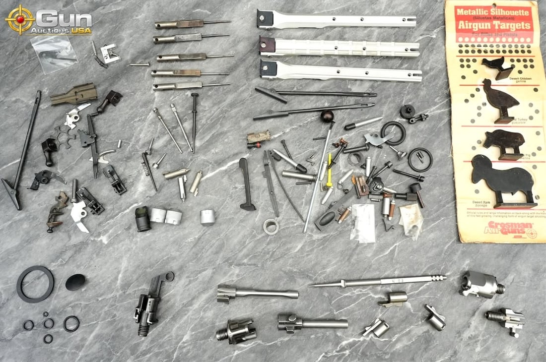 Crosman targets and firearm components. Good Condi: Crosman targets and firearm components. Good condition.This lot combines Crosman metallic airgun silhouette targets with an assortment of firearm parts, including firing pins, bolt components,