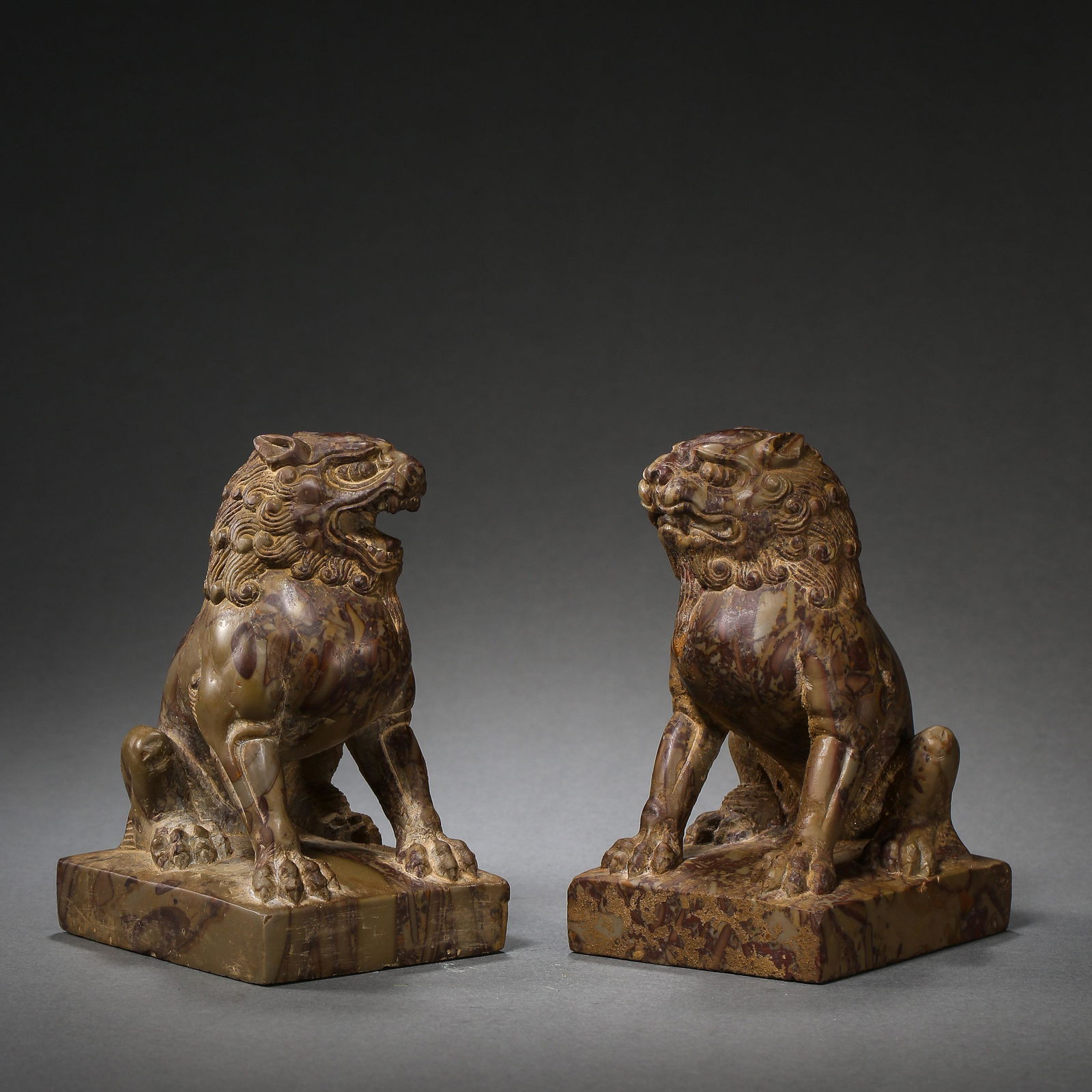 A PAIR OF CHINESE TANG DYNASTY BLUESTONE LIONS (1 of 12)