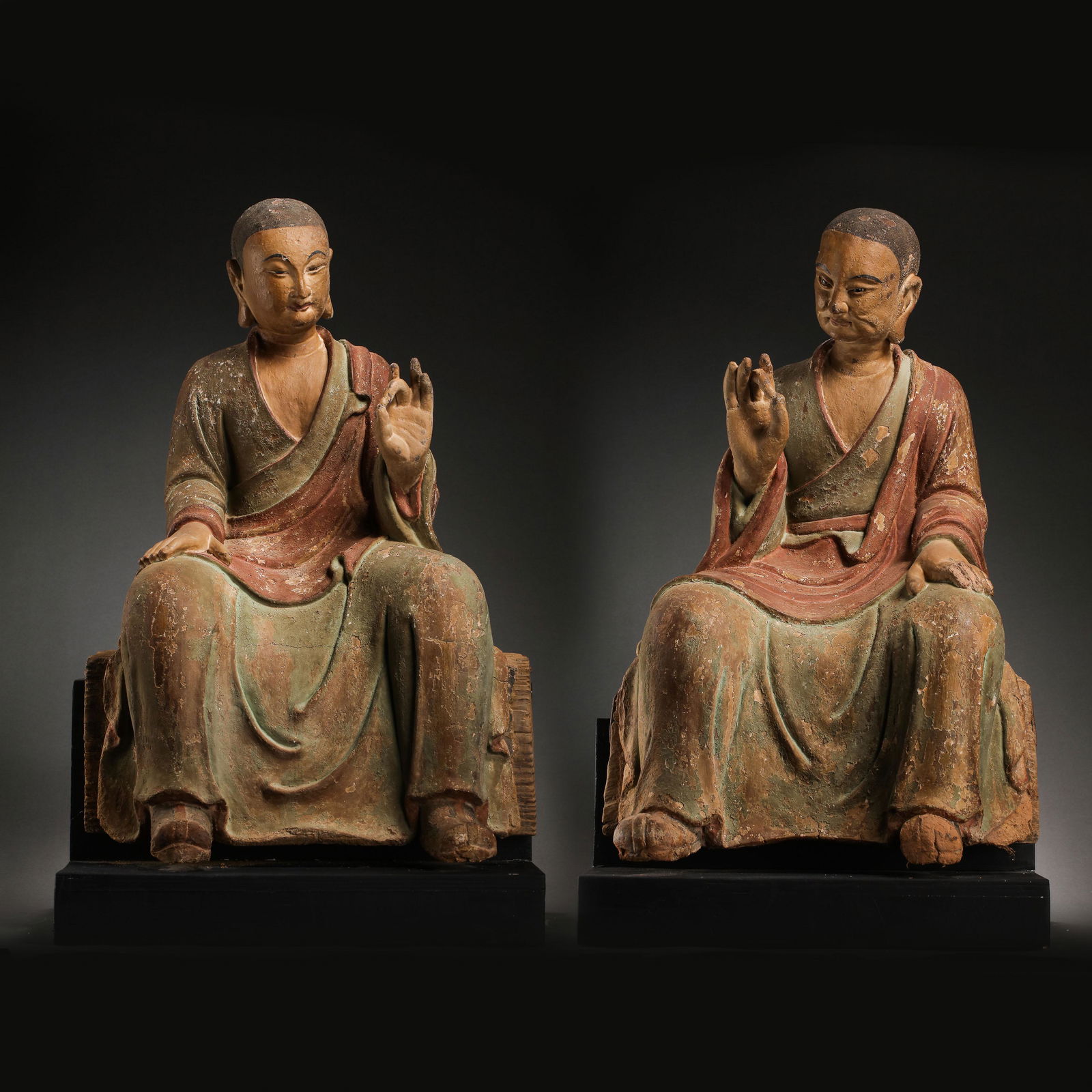 A PAIR OF SEATED CLAY SCULPTURES OF ARHATS, THE (1 of 18)