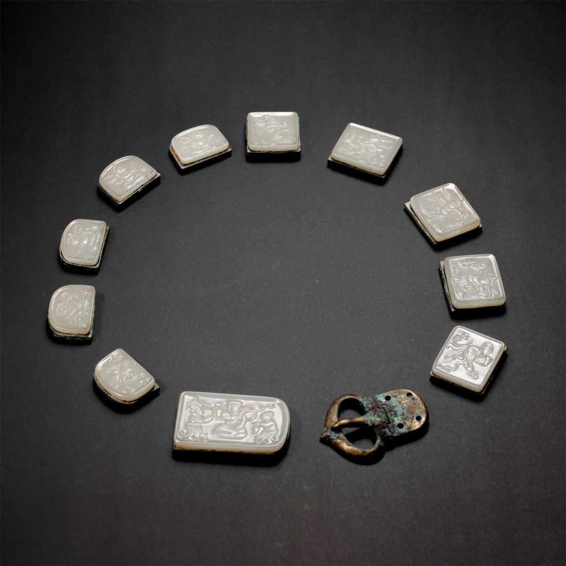A SET OF CHINESE TANG DYNASTY HETIAN JADE BELT PLATES, 7TH CENTURY (1 of 10)