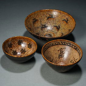 a group of 12th-13th century Southern Song Dynasty Jizhou ware paper-cut decal bowls
