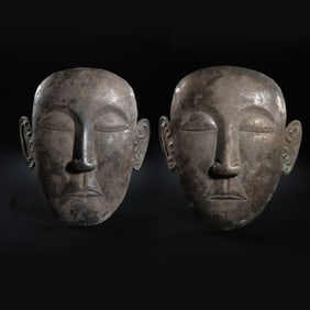 a pair of 10-12 centuries Liao Dynasty sterling silver masks
