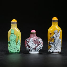 a group of qing dynasty glass character snuff bottles