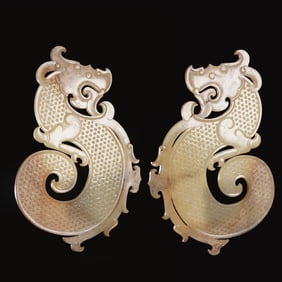A pair of jade S-shaped dragon pendants, 1st to 3rd centuries, Han Dynasty