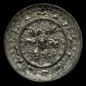 7th-10th century Tang Dynasty bronze mirror with sea beast and grape pattern