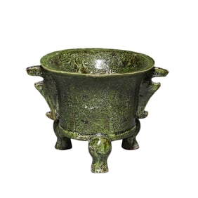 7th to the 10th century a twisted green-glazed three-legged cup, Tang Dynasty