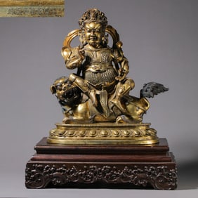 Chinese Qing Dynasty Qianlong period gilt bronze God of Wealth statue