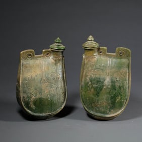 A pair of green-glazed leather flasks from the Liao Dynasty