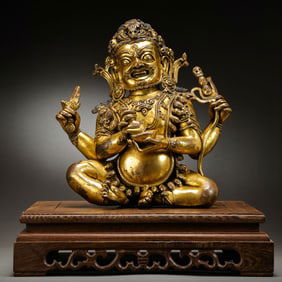 14th century bronze gilded four armed majestic celestial sitting statue
