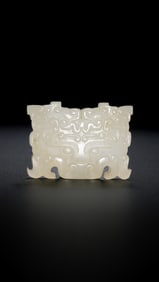 1ST-3RD CENTURY, CHINESE HAN DYNASTY, WHITE JADE PENDANT WITH ANIMAL FACE PATTERN