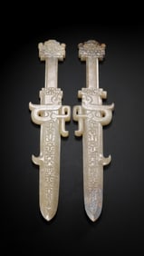 A PAIR OF 1-3 CENTURY, CHINESE HAN DYNASTY JADE SWORDS
