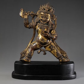 15TH CENTURY, CHINA MING DYNASTY GILT BRONZE GOD OF WEALTH STANDING