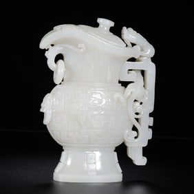 18TH CENTURY, CHINESE QING DYNASTY HOTAN WHITE JADE BEAST FACE DRAGON PATTERN GOBLET