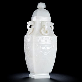 18TH CENTURY, CHINESE QING DYNASTY HETIAN WHITE JADE BEAST FACE PATTERN FOUR-RING EAR COVER BOTTLE