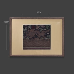 A textile cutting from a Qing Dynasty garment, woven with five-colored brocade in a striding dragon