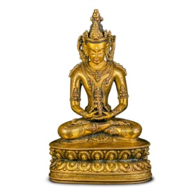 14A CHINESE GILT-BRONZE STATUE OF A SEATED BUDDHA FROM THE LATE YUAN DYNASTY, 16TH CENTURY
