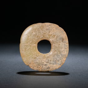 BEFORE THE MING DYNASTY, CHICKEN BONE WHITE JADE BI FROM THE HONGSHAN CULTURE OF THE NEOLITHIC
