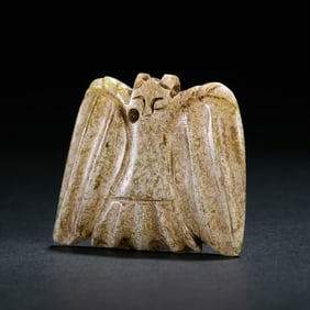 BEFORE THE MING DYNASTY, A CHICKEN BONE WHITE JADE OWL FROM THE HONGSHAN CULTURE OF THE NEOLITHIC