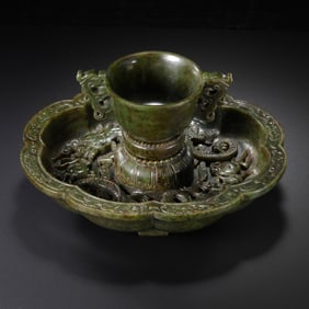 18A SET OF HETIAN JASPER DOUBLE-HANDLED FLOWER-SHAPED SAUCER HOLDERS, QING DYNASTY, CHINA