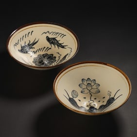 A pair of Chinese Northern Song Dynasty Cizhou kiln bamboo bowls with fish, algae and flower designs