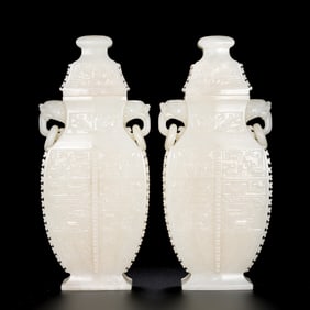 A pair of Chinese Qing Dynasty Hetian white jade double-ringed lidded vases
