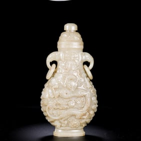 Chinese Qing Dynasty Hetian jade vase with double-ring ear lid and intricately carved dragon pattern
